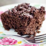 slice of vegan, gluten-free snack cake on a plate with a fork