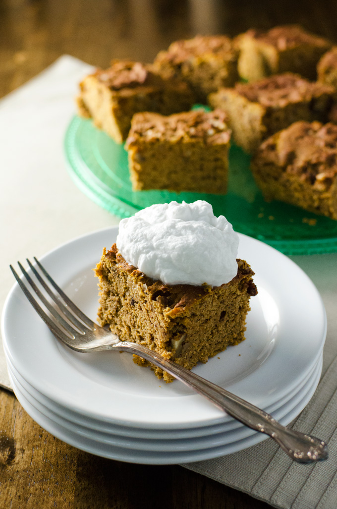 Gluten-Free Pumpkin Snack Cake with a dollop of whipped coconut cream