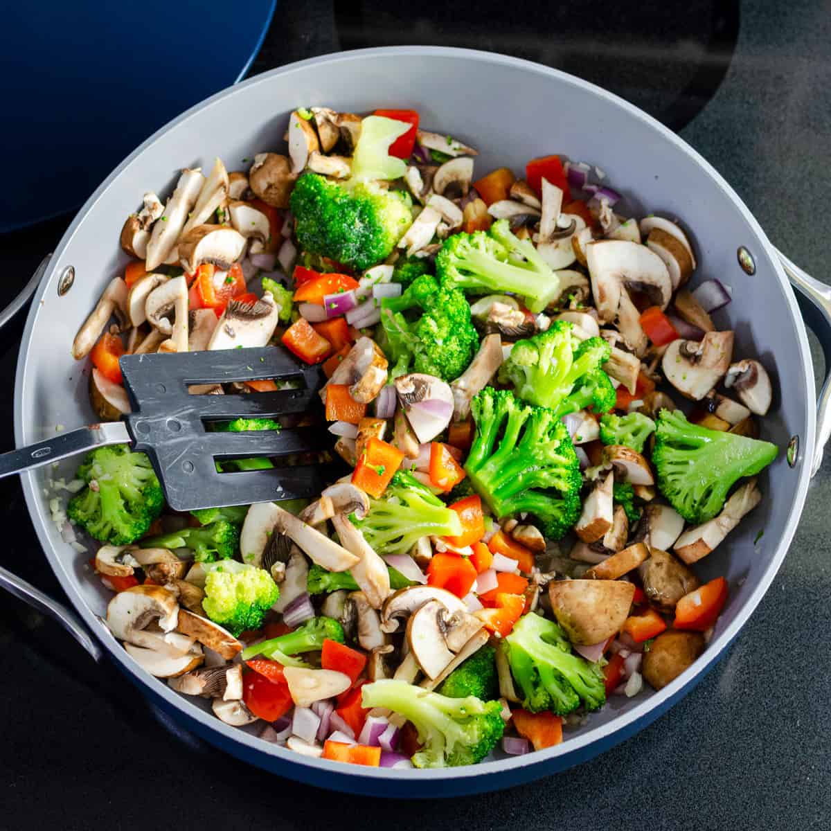 sauté pan full of vegetables for simple coconut curry recipe